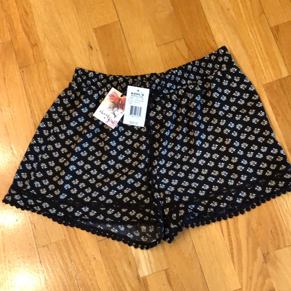 About a girl shorts.  New. Black and cream.